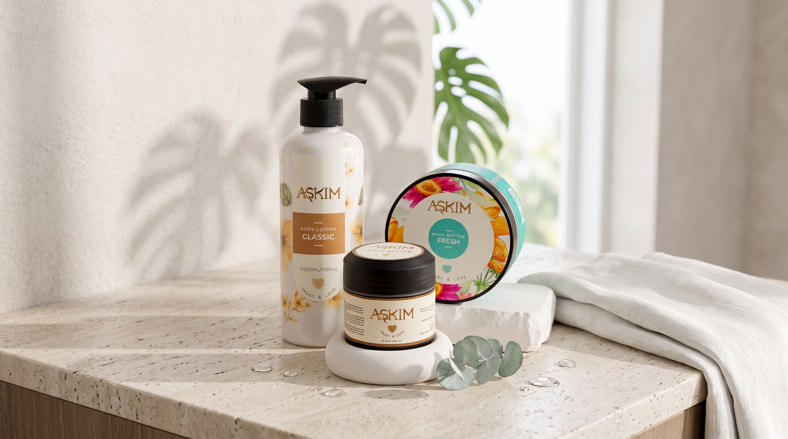 Summer body care routine — Askim body care set on a sunlit stone surface with linen towel and fresh eucalyptus