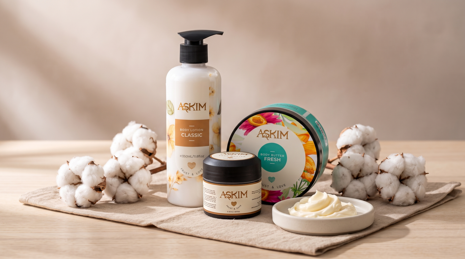 Askim body lotion and body butter products centered on a linen cloth with body butter swirls