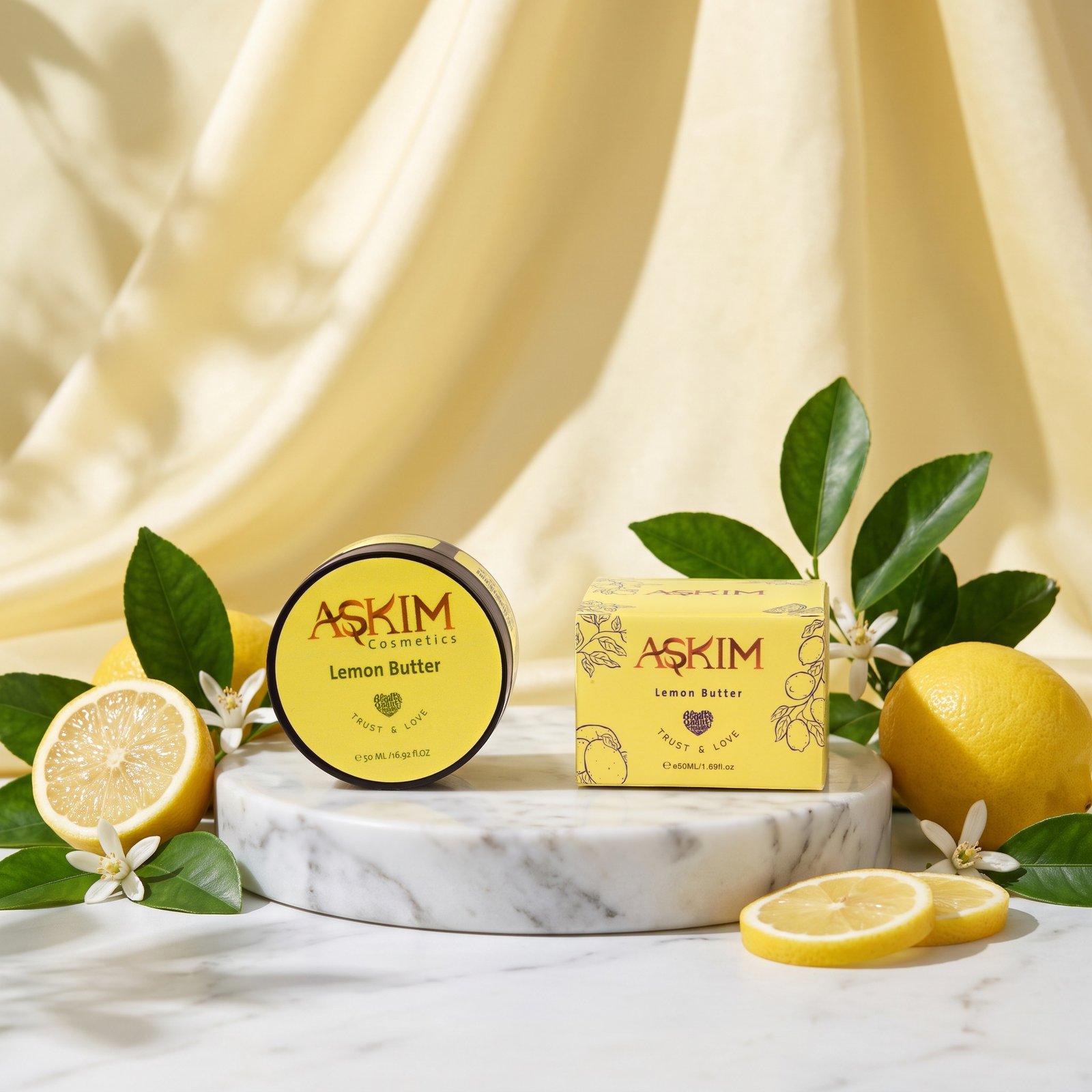 Lemon Butter jar and box with fresh lemons, lemon slices and lemon blossoms